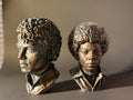 two bronze Michael Jackson at different ages